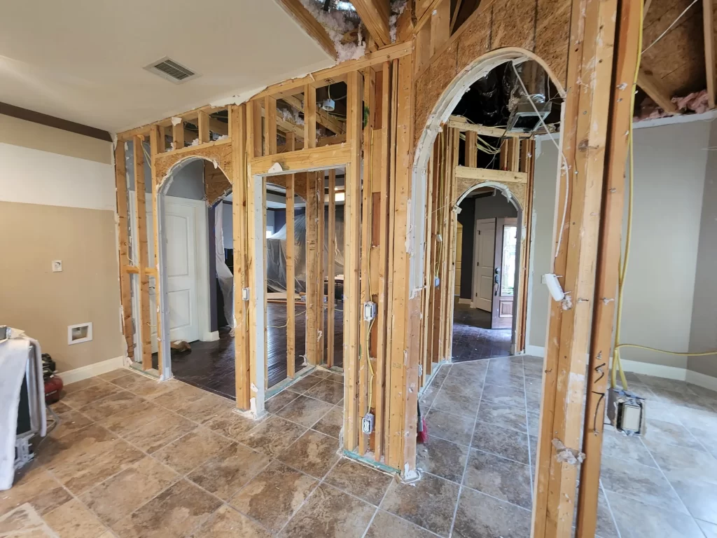 drywall removed from interior walls exposing studs